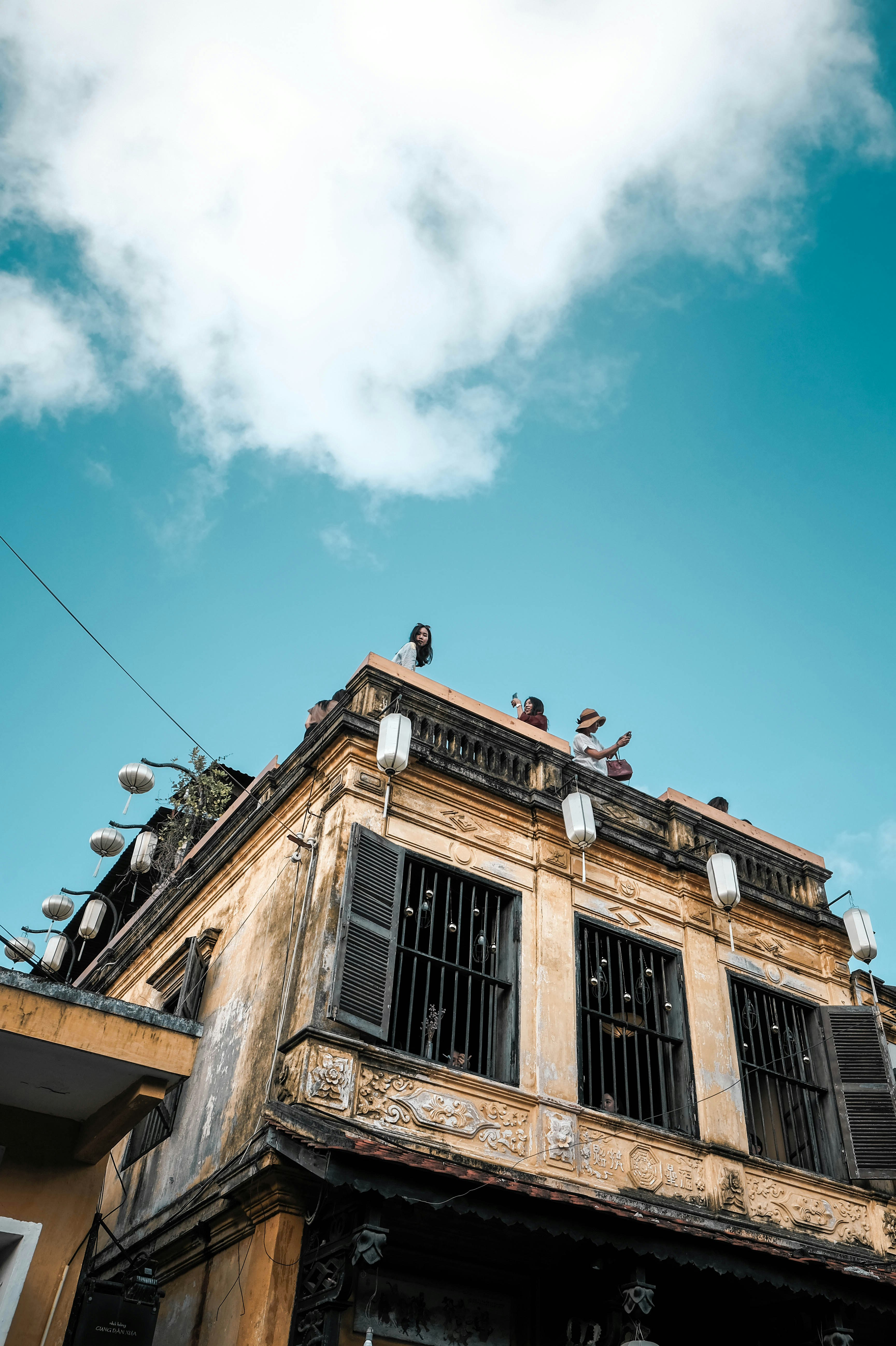 people at the roof of a building during day